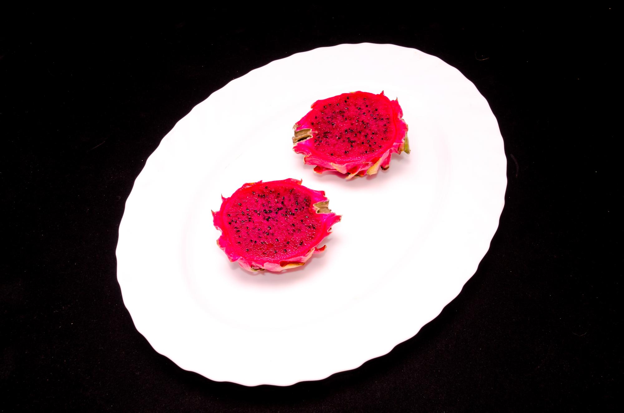 Detailed shot of plated dessert with edible flower